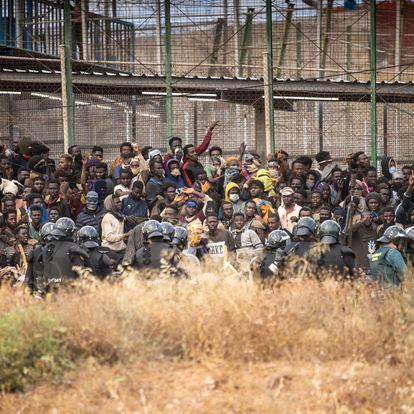 Migrants arrive on Spanish soil after crossing the fences separating the Spanish enclave of Melilla from Morocco in Melilla, Spain, Friday, June 24, 2022. Dozens of migrants stormed the border crossing between Morocco and the Spanish enclave city of Melilla on Friday in what is the first such incursion since Spain and Morocco mended diplomatic relations last month. (AP Photo/Javier Bernardo)