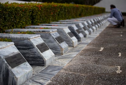 A man looks at the burial mounds (74 total, of which 67 are occupied) of the Monument to the Soviet Internationalist Soldier in Havana, Cuba.