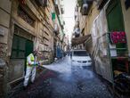 Naples (Italy), 18/03/2020.- A worker disinfects the street at Quartieri Spagnoli, Naples, Italy, 18 March 2020. According to the latest figures provided by the Civil Protection agency, Italy has recorded 35,713 confirmed coronavirus infections, while the death toll has climbed up to 2,978. (Italia, Nápoles) EFE/EPA/CESARE ABBATE