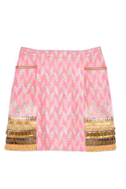 Matthew Williamson incoropora tiras de abalorios para darle un toque más sofisticado a esta falda con motivos espigados en rosa chicle (1155 euros).