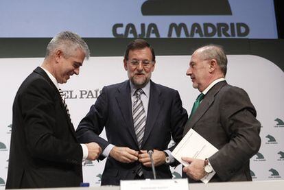 Javier Moreno, Mariano Rajoy y Rodrigo Rato.