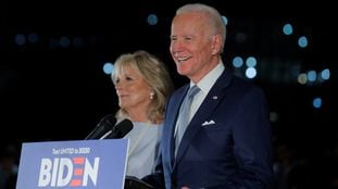 Democratic U.S. presidential candidate and former Vice President Joe Biden smiles as he speaks with his wife Jill at his side during a primary night news conference at The National Constitution Center in Philadelphia, Pennsylvania, U.S., March 10, 2020. REUTERS/Brendan McDermid