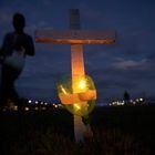 Members of various social movements perform an act in which they light candles attached to 400 crosses, in front of the National Congress building, in tribute to the 395,000 deaths due to covid-19 that Brazil has accumulated since the start of the health crisis, a little over a year ago.