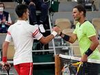 Serbia's Novak Djokovic, left, shakes hands with Spain's Rafael Nadal after their semifinal match of the French Open tennis tournament at the Roland Garros stadium Friday, June 11, 2021 in Paris. Novak Djokovic won 3-6, 6-3, 7-6 (4), 6-2. (AP Photo/Michel Euler)