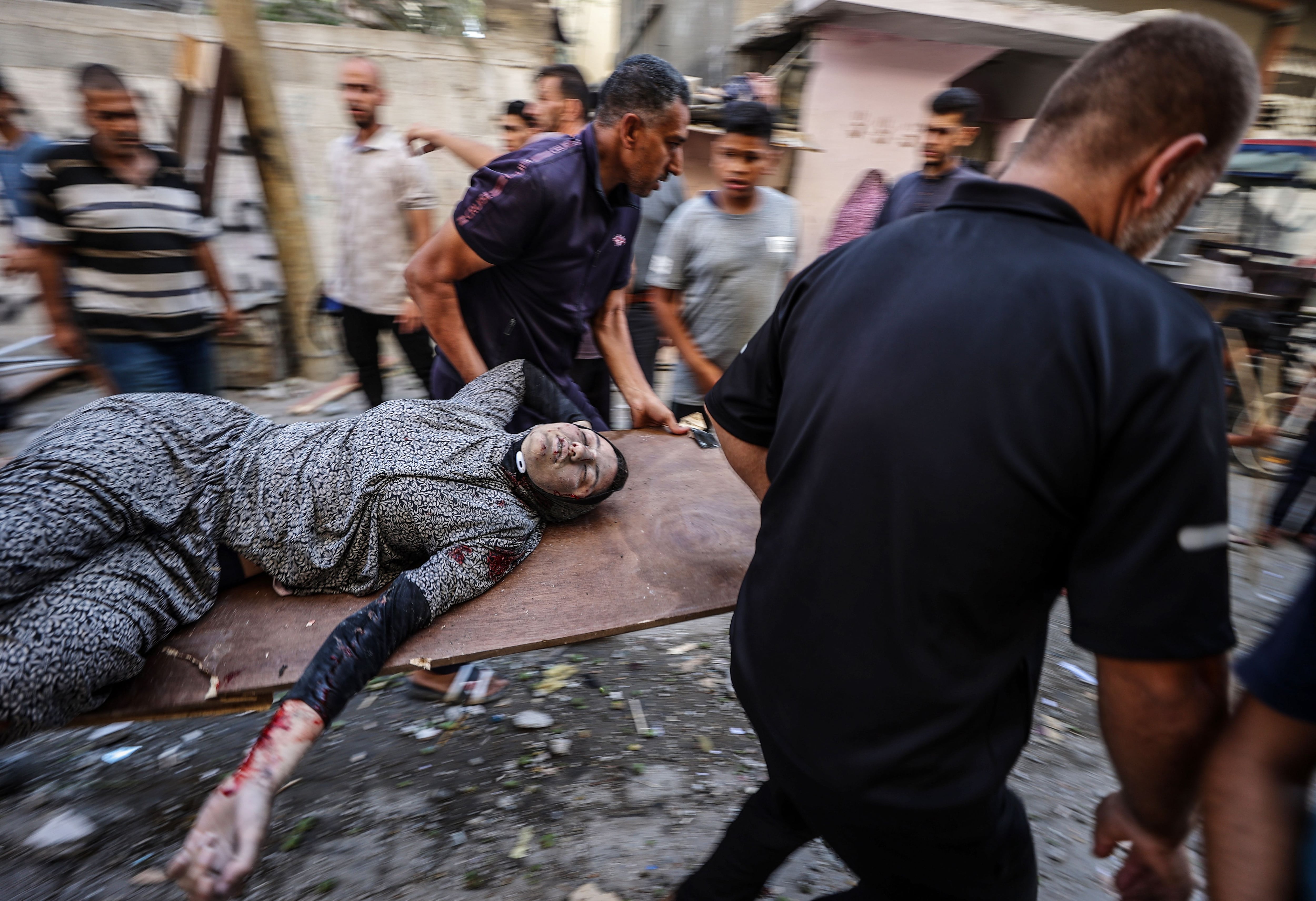 Civilians evacuate people who were affected after the Israeli attack on a house, which resulted in casualties and injuries in Deir Al Balah, Gaza on July 02, 2024. (Photo by Ali Jadallah/Anadolu via Getty Images)
