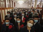 Beijing (China), 08/09/2020.- Attendees wearing protective face masks arrive for a meeting commending role models in the country&#39;s fight against the COVID-19 epidemic at the Great Hall of the People (GHOP) in Beijing, China, 08 September 2020. The ceremony is held to honour people who were involved in the fight against the COVID-19 coronavirus. EFE/EPA/WU HONG
