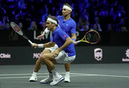 Rafael Nadal and Roger Federer on a tile, during their Laver Cup doubles match.
