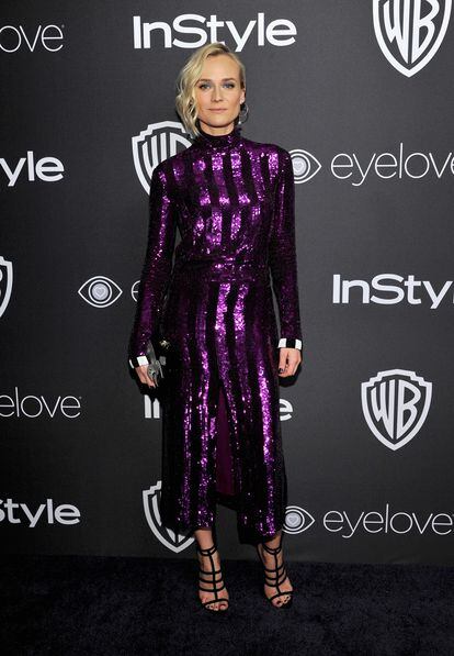 Diane Kruger apostó por un vestido de rayas de color púrpura de la colección primavera-verano 2017 de Nina Ricci. Arriesgada y perfecta.