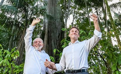 Ignacio Lula da Silva, left, and Emmanuel Macron arrive at Combu Island, Brazil.
