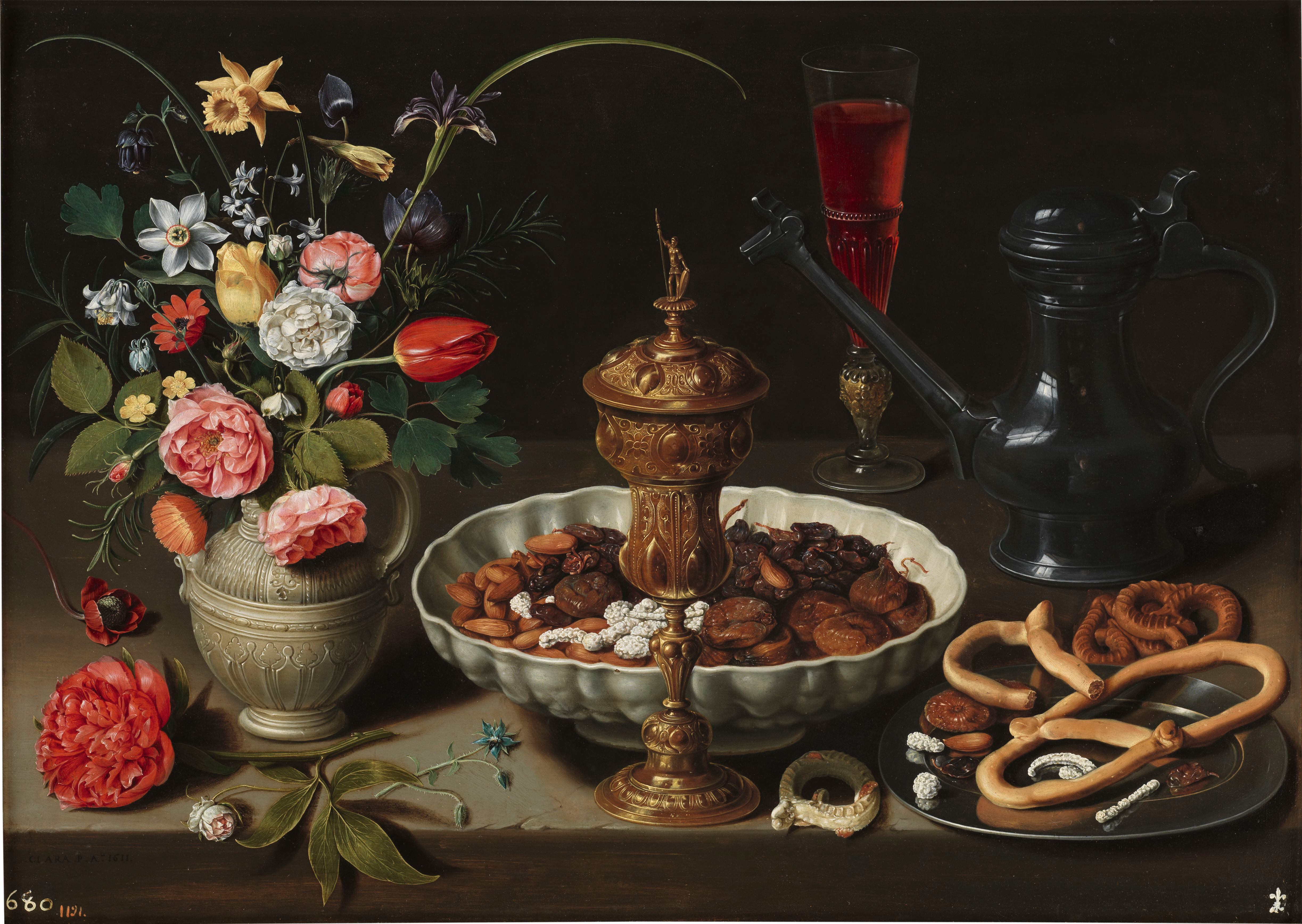 Bodegón con flores, copa de plata dorada, almendras, frutos secos, dulces, panecillos, vino y jarra de Peltre, 1611. Obra de Clara Peeters.