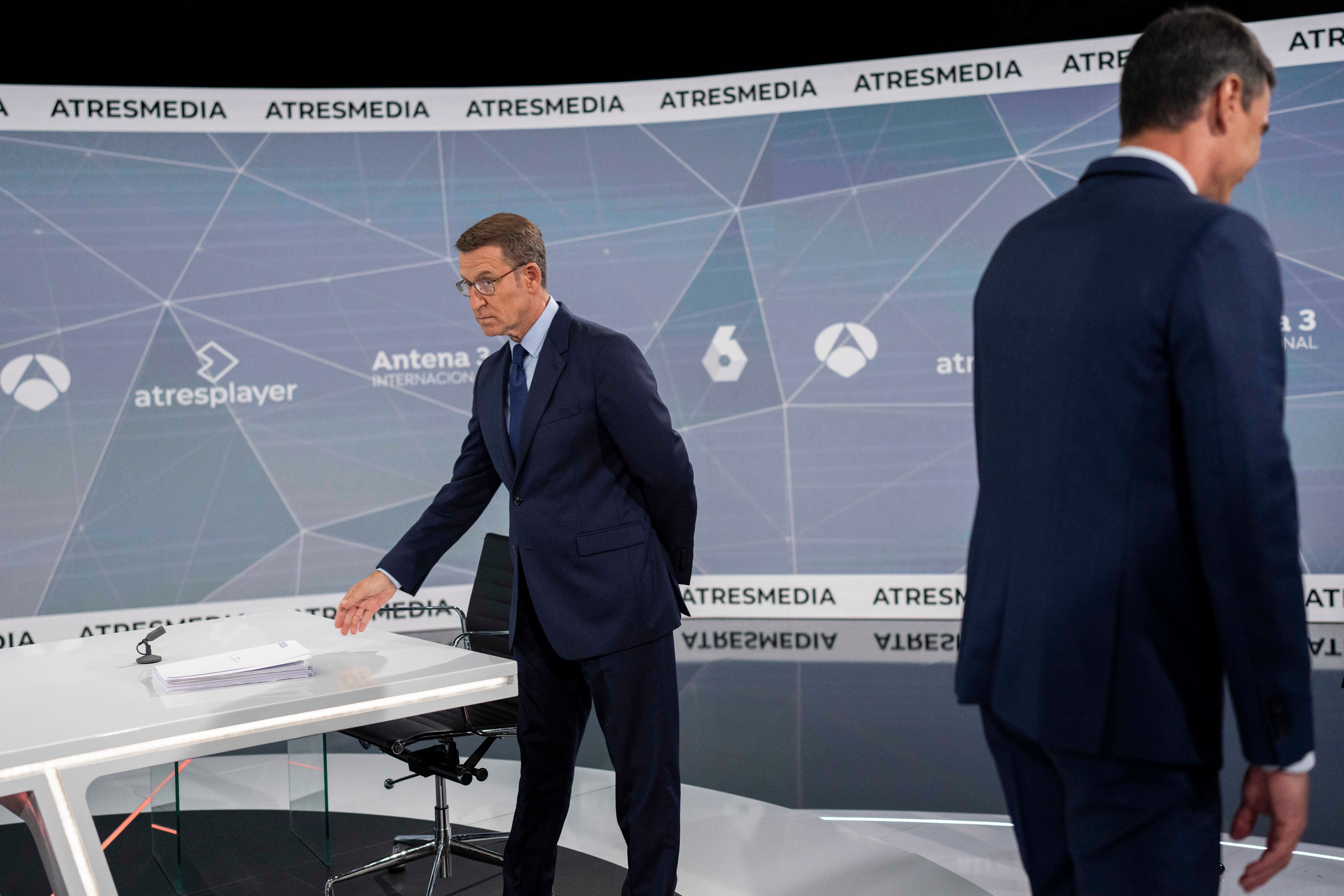 Popular Party candidate Nunez Feijóo, left, and Spain's Prime Minister and Socialist candidate Pedro Sánchez, right, prior to the televised live debate ahead of Spain's general election in Madrid, Spain, Monday, July 10, 2023. (AP Photo/Bernat Armangue)