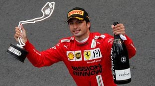 Second place Ferrari driver Carlos Sainz of Spain celebrate with his trophy during the Monaco Grand Prix at the Monaco racetrack, in Monaco, Sunday, May 23, 2021. (Gonzalo Fuentes, Pool via AP)