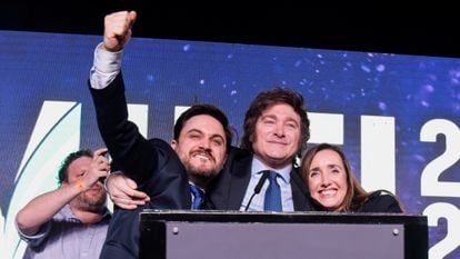 Argentine presidential candidate of the La Libertad Avanza alliance, Javier Milei, reacts with Ramiro Marra, candidate for head of government of Buenos Aires, and Victoria Villarruel
