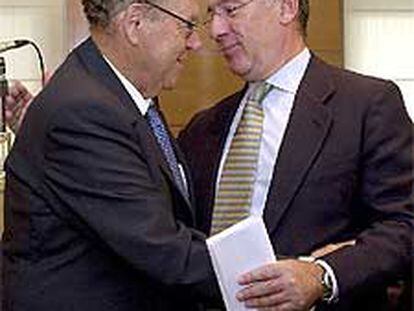Enrique Aldama, a la izquierda, y Rodrigo Rato.
