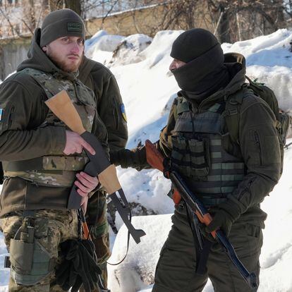 Member of Georgian Legion Emanuel Bazanji, 25, second left, from Albania, a former professional soldier, trains with teammates of the Georgian Legion in their base in Kyiv, Ukraine, Friday, Jan. 4, 2022. The paramilitary unit formed mainly by ethnic Georgian volunteers to fight against Russian aggression in Ukraine in 2014, now includes people of various nationalities. Currently there are few US citizens in the Georgian Legion, but according to its commander Mamuka Mamulashvili, by the end of February there will be at least 30 Americans joining. (AP Photo/Efrem Lukatsky)