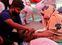 Family members of Nanhe Pal, 52, who is suffering from breathing problem, provides him oxygen support for free at a Gurudwara (Sikh temple), amidst the spread of coronavirus disease (COVID-19), in Ghaziabad, India, May 3, 2021. REUTERS/Adnan Abidi