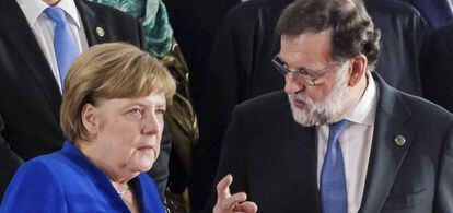 Rajoy y Merkel en la Costa de Marfil.