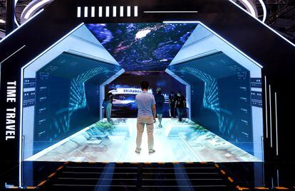 Visitors at one of the Metaverse Experience exhibitors at a trade show in Beijing.