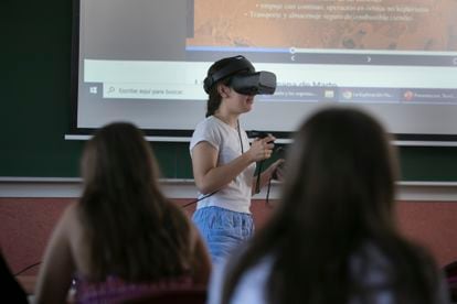 A student tours the houses and greenhouses of the lunar bases and drives rovers over their surfaces with virtual glasses.