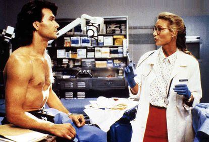 Patrick Swayze, shirtless, and Kelly Lynch in 'Professional: Hard'.