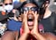 TOPSHOT - A protester leads a crowd in a back and forth chant during a rally in support of George Floyd and against police brutality at Dolores Park in San Francisco, California on June 3, 2020. - Thousands of people gathered at Dolores Park and marched through the city in support of George Floyd and against police brutality. (Photo by Josh Edelson / AFP)