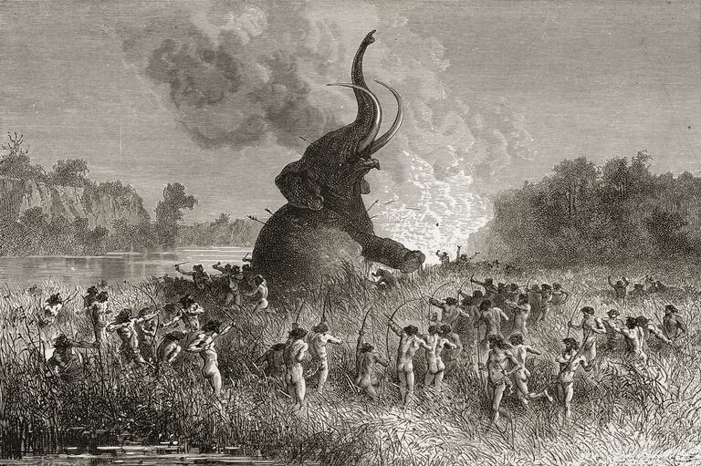 Hombres prehistóricos cazan un mamut en una ilustración de 1896.
