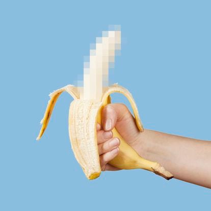 Hidden censored banana in hand on a blue background. Horny (aroused) penis, male erection and sexual education. Funny pornography. (Hidden censored banana in hand on a blue background. Horny (aroused) penis, male erection and sexual education. Funny p