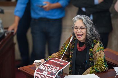 Congress member Maria Jose Pizarro speaks with a massacre of Putumayo banner during the motion to censure to Colombia's Minister of Defense Diego Molano at Colombian congress for a military raid that resulted in 11 death including four suspected civilians alleged by authorities to be passed of by guerilla members, in Bogota, Colombia April 26, 2022. (Photo by Sebastian Barros/NurPhoto via Getty Images)