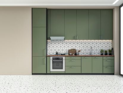 Una moderna cocina en color verde y con suelo de terrazo.