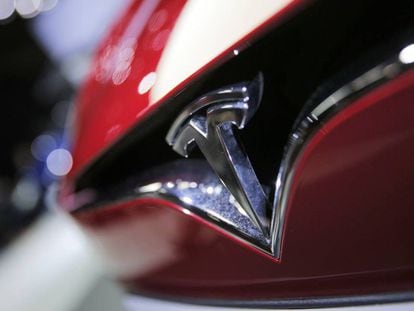 FILE- This Sept. 30, 2016, file photo shows the logo of the Tesla model S at the Paris Auto Show in Paris, France. The Autopilot system on a Telsa Model S may have helped the California Highway Patrol stop the car after its driver fell asleep on a freeway. (AP Photo/Christophe Ena, File)