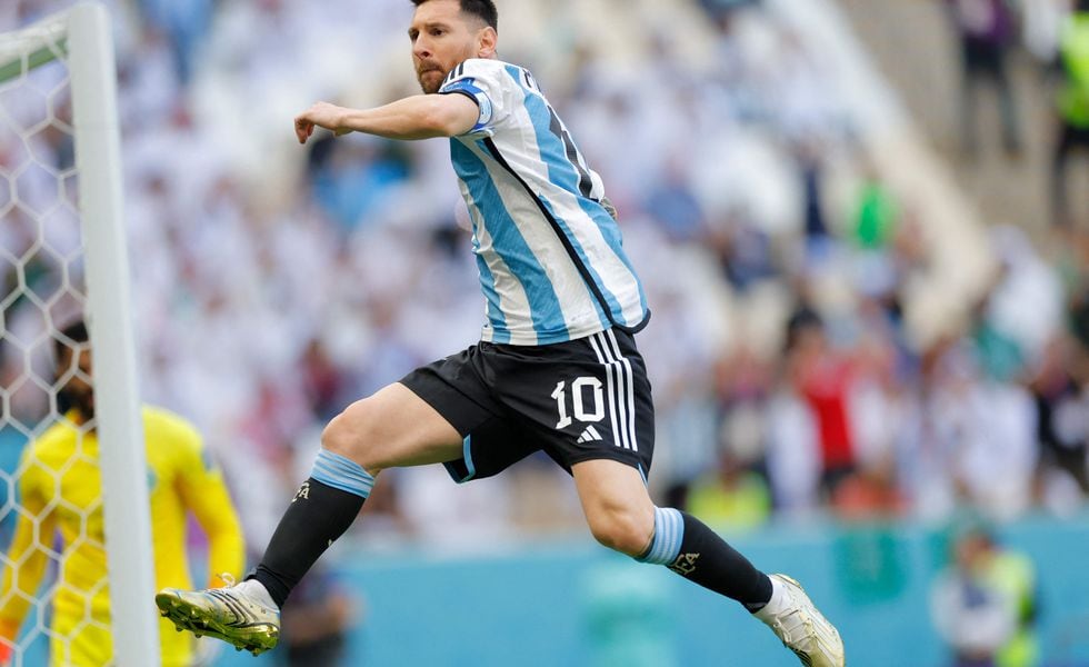 Argentina's forward #10 Lionel Messi celebrates after taking a penalty to score his team's first goal during the Qatar 2022 World Cup Group C football match between Argentina and Saudi Arabia at the Lusail Stadium in Lusail, north of Doha on November 22, 2022. (Photo by Odd ANDERSEN / AFP)