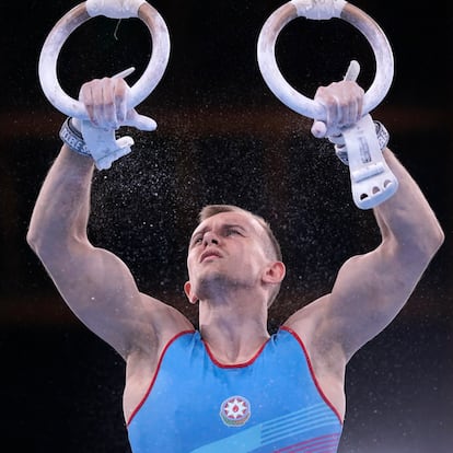 Ivan Tikhonov, of Azerbaijan, performs on the rings during the men's artistic gymnastic qualifications at the 2020 Summer Olympics, Saturday, July 24, 2021, in Tokyo. (AP Photo/Gregory Bull)