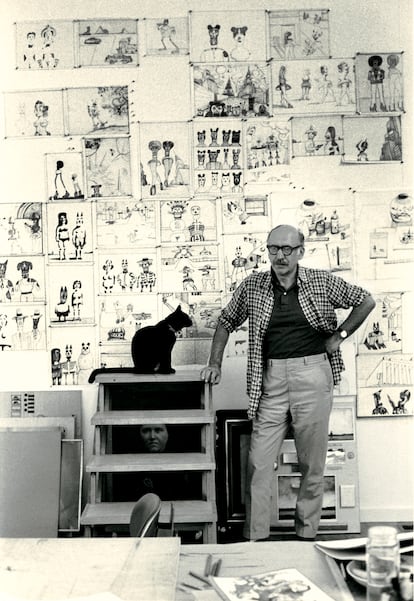 Saul Steinberg with his cat 'Papoose' in his studio in Amagansett, Long Island, in 1974.