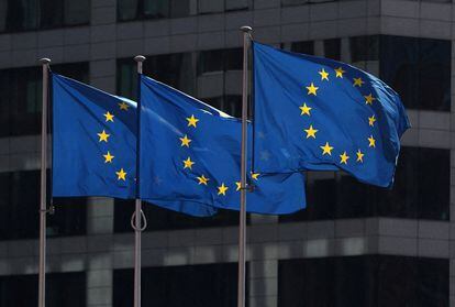 Three European flags fly in front of the European Union offices in Brussels, Belgium.
