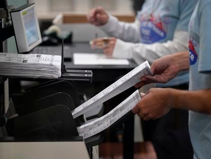 Election workers process ballots at the Clark County Election Department, Friday, Nov. 11, 2022, in Las Vegas. (AP Photo/John Locher)
