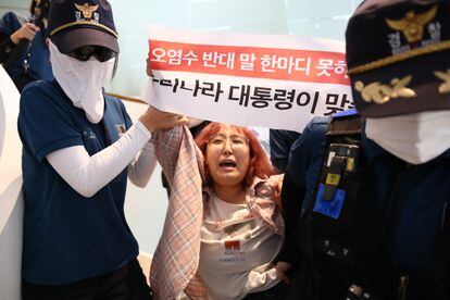 A South Korean student protests in front of the Japanese Embassy in Seoul on Thursday over the dumping of contaminated water from the central Pacific Ocean.