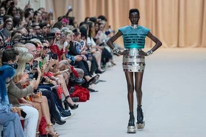 A model wears a Jean Paul Gaultier haute couture creation, inspired by the Frenchman's Le Male perfume bottle, during the brand's fashion show on July 6, 2022 in Paris.