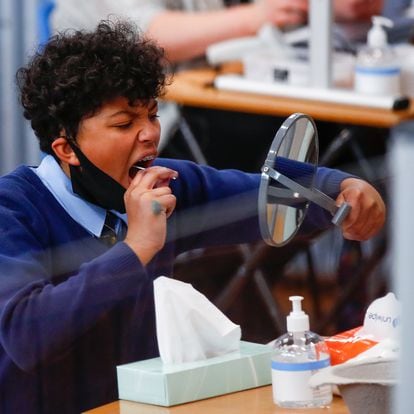 A student takes a lateral flow test at Weaverham High School, as the coronavirus disease (COVID-19) lockdown begins to ease, in Cheshire, Britain, March 9, 2021. REUTERS/Jason Cairnduff