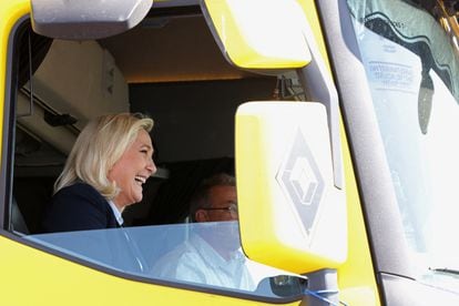 Marine Le Pen in a yellow truck shortly before her rally in Arras. 