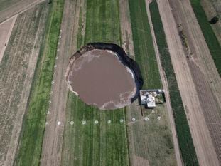 An aerial view of the sinkhole in Santa María Zacatepec, taken on June 1 (Spanish-language video).