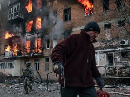 A local resident leaves his home after Russian shelling destroyed an apartment house in Bakhmut, Donetsk region.