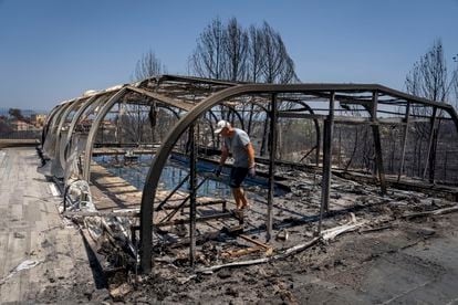 A neighbor on Tuesday checked the damage to his swimming pool after a fire near the town of El Pont de Vilomara in Barcelona.