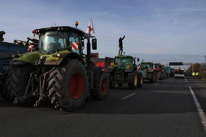 A farmer takes a selfie on the roof of his tractor during a blockade of the A6 motorway near Villabe, south of Paris.