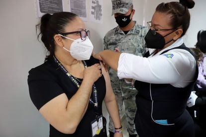 A woman receives the coronavirus vaccine at a medical center in Culiacán, Sinaloa.