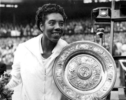 Althea Gibson, with her trophy at Wimbledon in 1958.