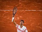 Serbia's Novak Djokovic celebrates after winning against Spain's Rafael Nadal at the end of their men's singles semi-final tennis match on Day 13 of The Roland Garros 2021 French Open tennis tournament in Paris on June 11, 2021. (Photo by Christophe ARCHAMBAULT / AFP)