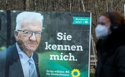 An election placard shows Baden Wuerttemberg State Prime Minister Winfried Kretschmann, top candidate of The Greens for the upcoming Baden Wuerttemberg state elections in Stuttgart, Germany, March 10, 2021, REUTERS/Ralph Orlowski