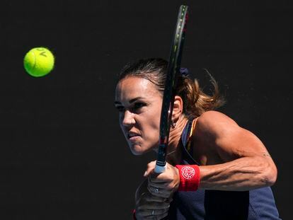 Nuria Parrizas Diaz of Spain plays a backhand return to Jessica Pegula of the U.S. during their third round match at the Australian Open tennis championships in Melbourne, Australia, Friday, Jan. 21, 2022. (AP Photo/Simon Baker)