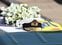 A military hat rests on the coffin of Prince Philip as it is transported by the hearse, a specially modified Land Rover, during the funeral of Britain's Prince Philip, husband of Queen Elizabeth, who died at the age of 99, on the grounds of Windsor Castle in Windsor, Britain, April 17, 2021. Leon Neal/Pool via REUTERS