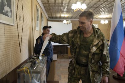 A military man votes in Lugansk, a territory in eastern Ukraine controlled by Russia. 